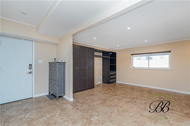 unfurnished bedroom with a closet, recessed lighting, and baseboards