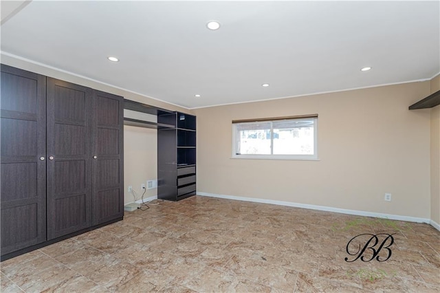 unfurnished bedroom with recessed lighting, a closet, and baseboards