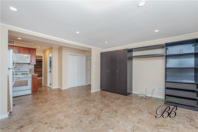 interior space featuring baseboards, visible vents, multiple closets, and recessed lighting