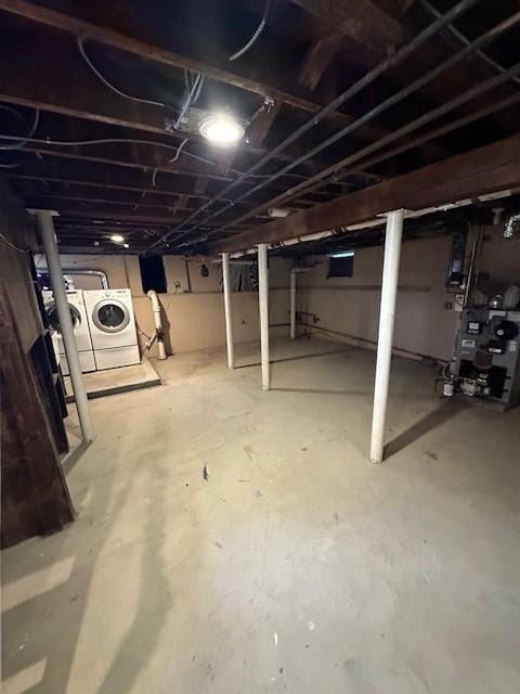 basement with washer and clothes dryer