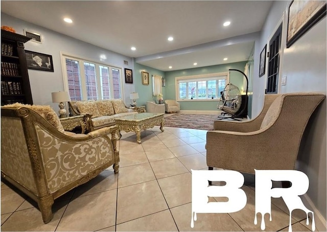 living room featuring plenty of natural light and light tile patterned flooring