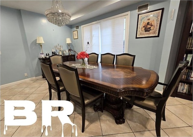 dining space featuring light tile patterned floors and an inviting chandelier