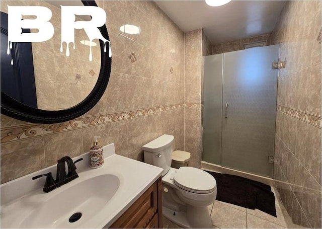 bathroom with walk in shower, toilet, tile walls, vanity, and tile patterned flooring