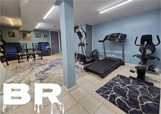 workout room with light tile patterned floors