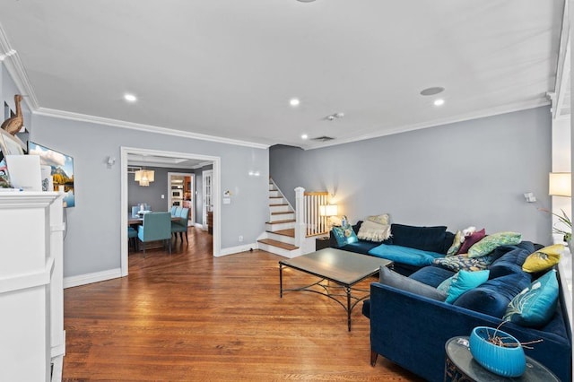 living room with crown molding and hardwood / wood-style floors