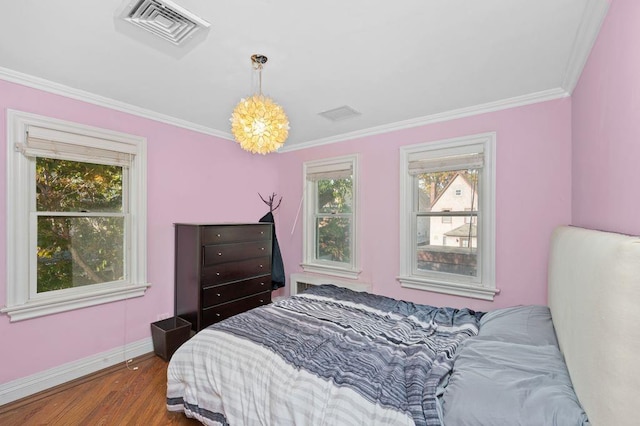 bedroom featuring dark wood-type flooring and crown molding