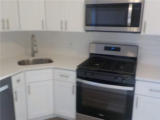 1200 E 53rd St Unit 7B, Brooklyn, NY 11234 - kitchen featuring stainless steel appliances, a sink, white cabinetry, and light countertops