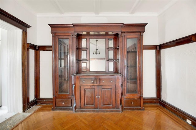 details with a notable chandelier and parquet flooring