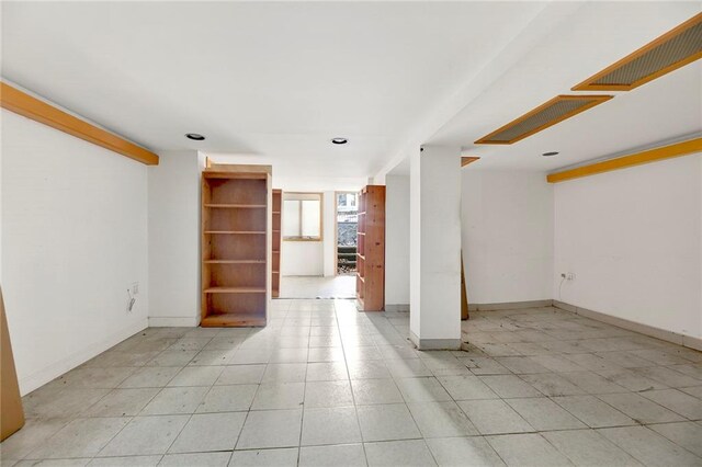 spare room with light tile patterned floors