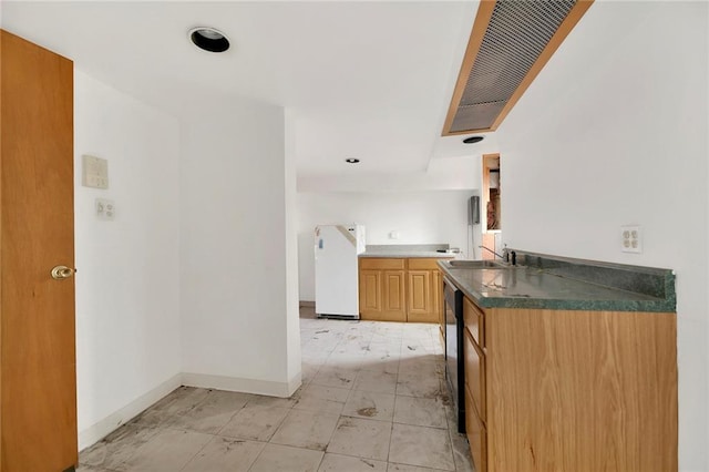 kitchen with black dishwasher, white fridge, kitchen peninsula, and sink