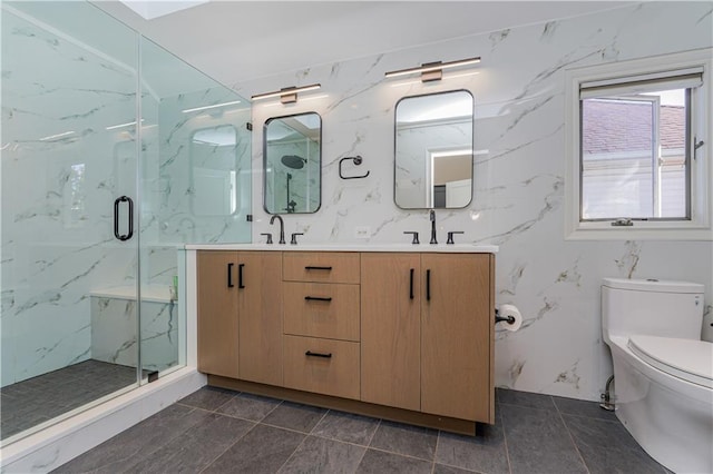 bathroom with walk in shower, vanity, and toilet