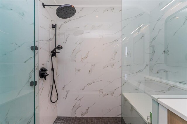 bathroom with tiled shower