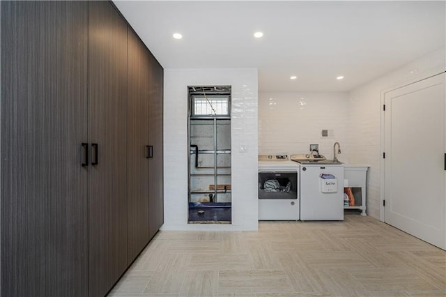 laundry room featuring separate washer and dryer