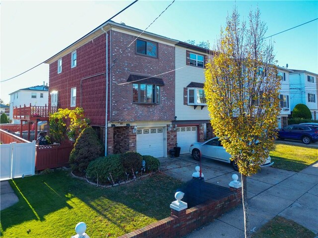 view of front facade with a garage and a front yard