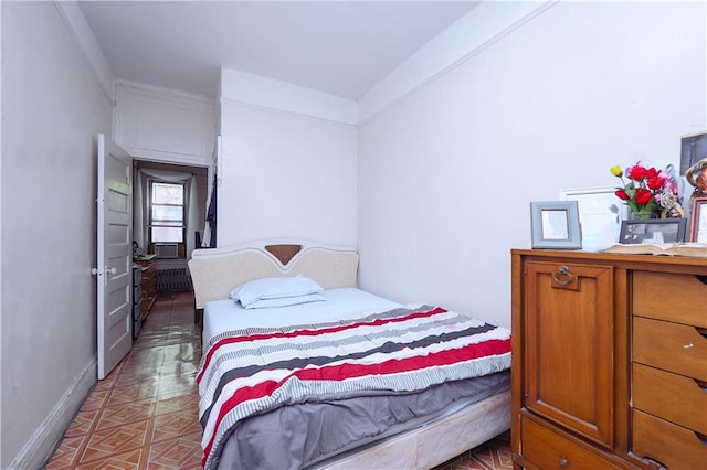 bedroom with ornamental molding