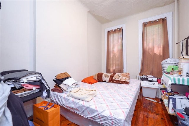 bedroom featuring dark wood-type flooring