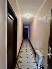 corridor with crown molding