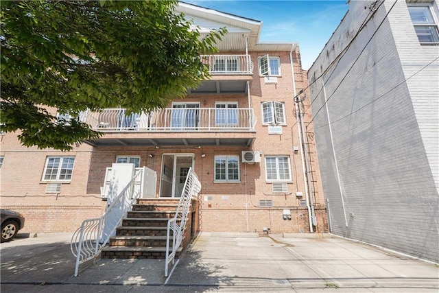 view of property featuring a wall mounted AC