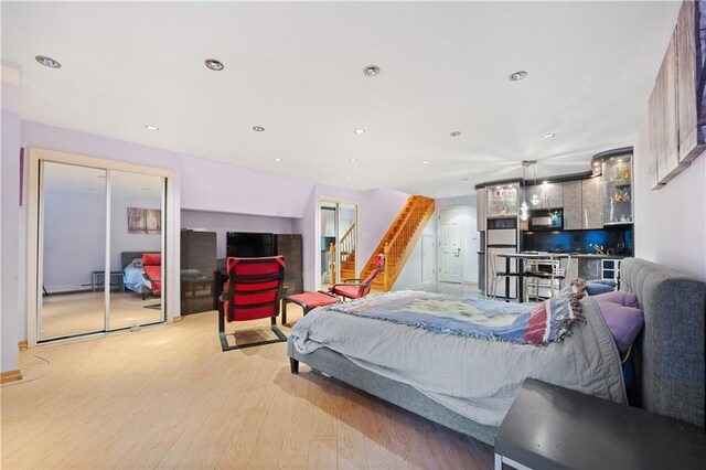 bedroom with light hardwood / wood-style floors