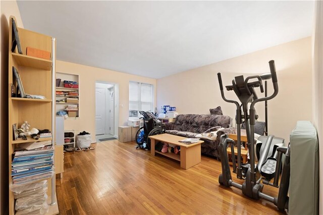 exercise area with light hardwood / wood-style floors