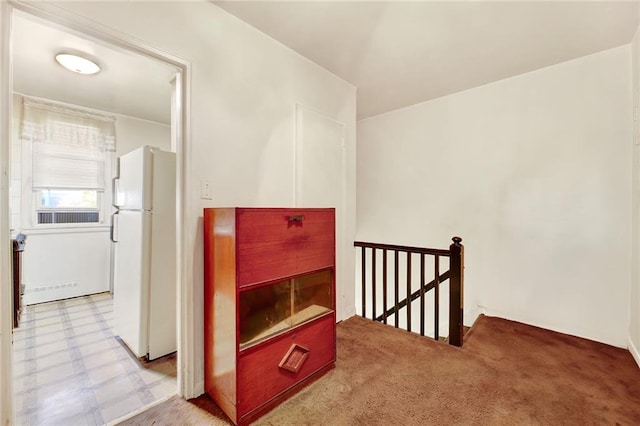 corridor with light colored carpet