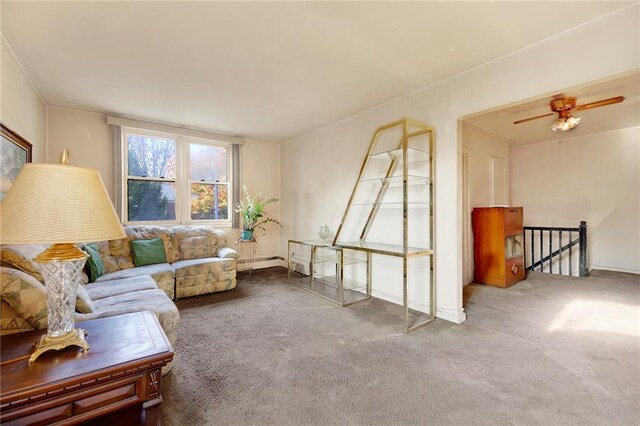 living room with carpet, ceiling fan, and baseboard heating