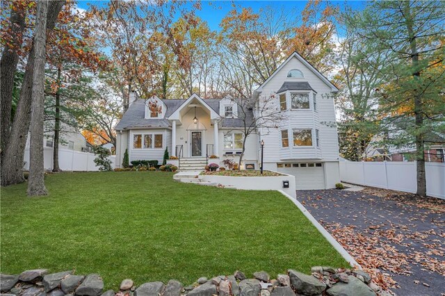 view of front facade with a front lawn and a garage