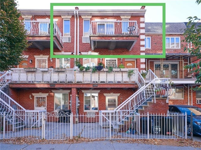 view of property featuring fence private yard and stairs