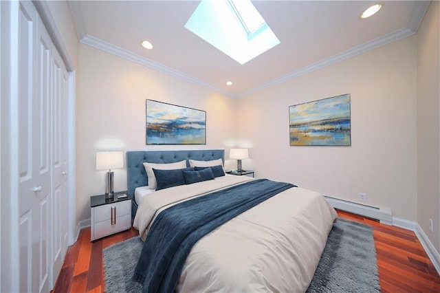 bedroom featuring crown molding, dark wood-type flooring, a closet, and baseboard heating