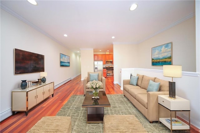 living room with crown molding, baseboard heating, and hardwood / wood-style floors