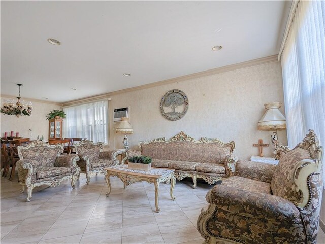 living room with a chandelier, a wall mounted AC, and crown molding