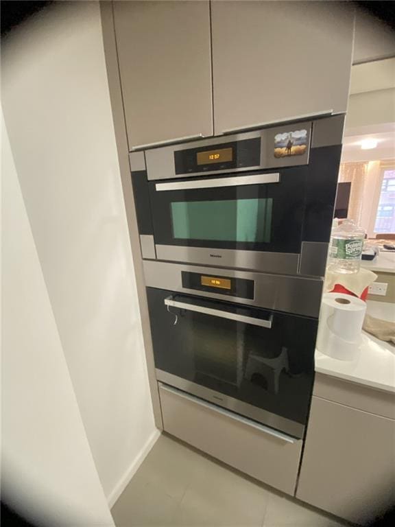 234 E 70th St Unit 4, New York, NY 10021 - detailed view of double oven, light countertops, and modern cabinets