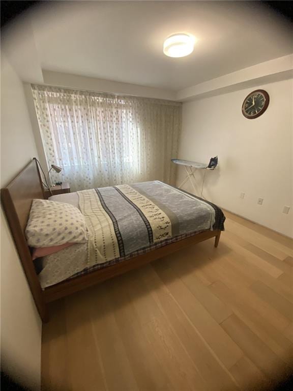 bedroom featuring hardwood / wood-style flooring