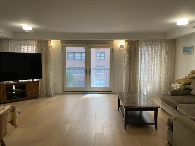 234 E 70th St Unit 4, New York, NY 10021 - living room featuring french doors and light wood-style flooring