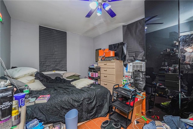 bedroom with ceiling fan and cooling unit