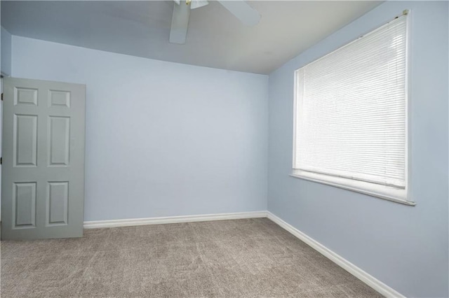 unfurnished room featuring ceiling fan and light colored carpet