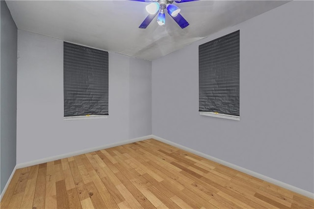 unfurnished room with wood-type flooring and ceiling fan