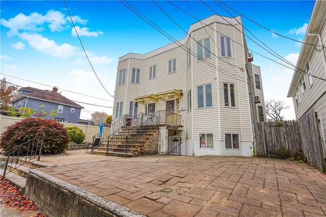 back of property with a patio area