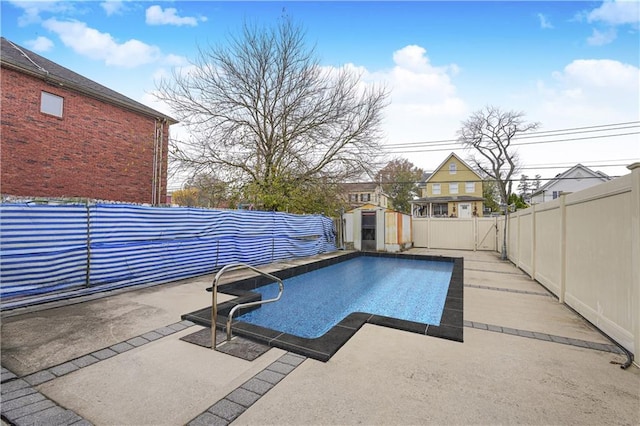 view of swimming pool with a patio area