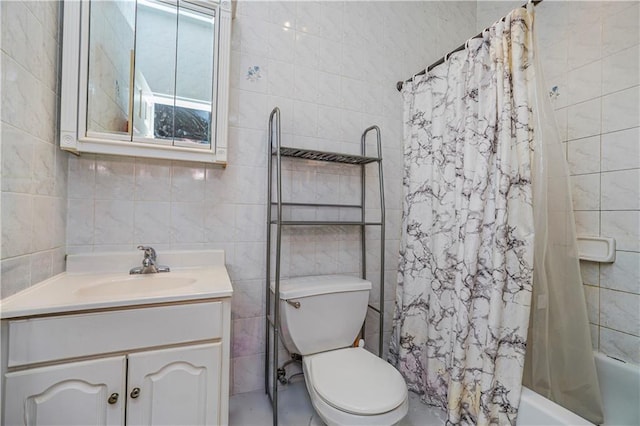 full bathroom with shower / bath combo, vanity, toilet, and tile walls