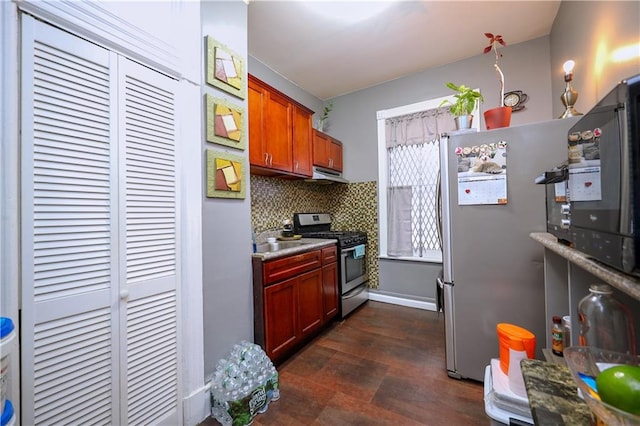 kitchen featuring appliances with stainless steel finishes, sink, tasteful backsplash, and ventilation hood