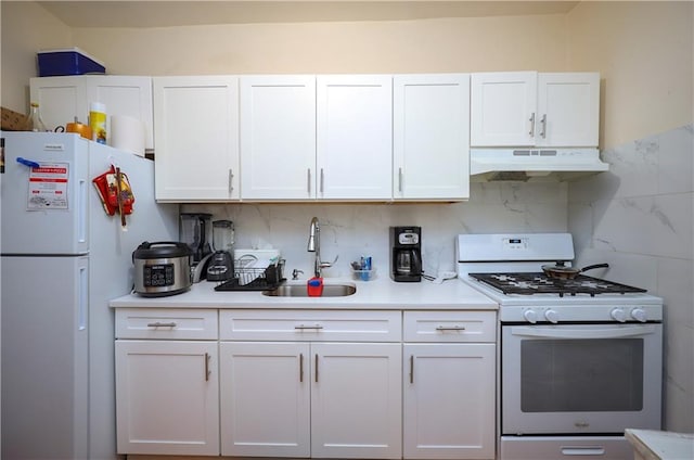 kitchen featuring white cabinets, white appliances, sink, and tasteful backsplash