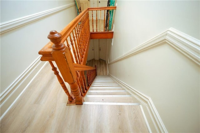 stairway with wood-type flooring