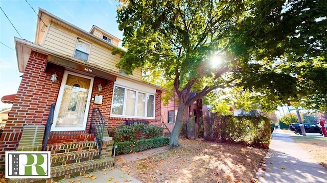 view of front of house featuring brick siding