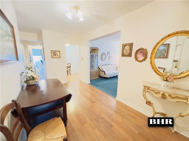 hallway with light hardwood / wood-style floors