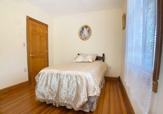 bedroom featuring wood-type flooring