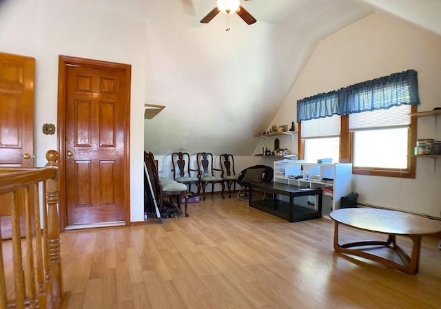 interior space with ceiling fan, light hardwood / wood-style flooring, and lofted ceiling