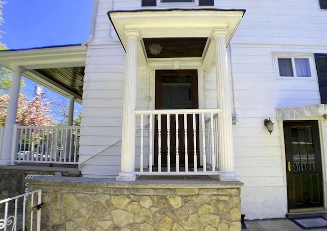 doorway to property featuring a porch