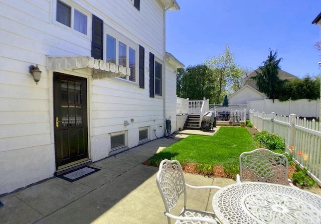 view of yard featuring a patio area and a deck