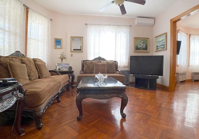 living room with parquet flooring, radiator, ceiling fan, and a wall mounted air conditioner